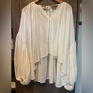 Elegant White Women's Oversized Peasant Crinkle hi-low Top with ballon sleeves .